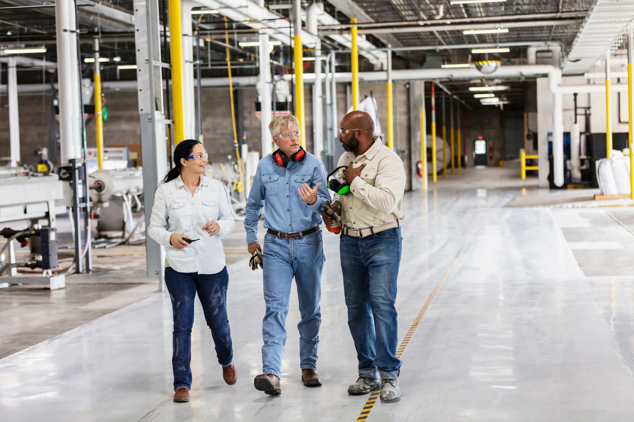 Manufacturing team walking the factory floor during production support